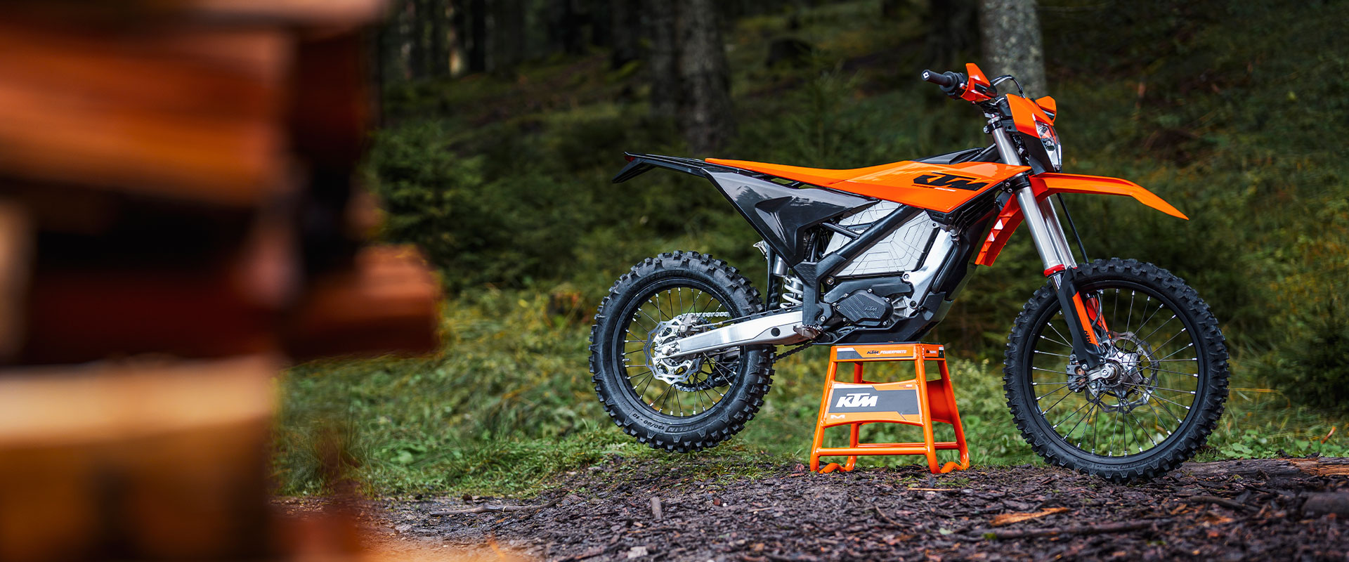 2027 KTM Freeride E — orange electric dual-sport staged on dirt, street-legal MY27